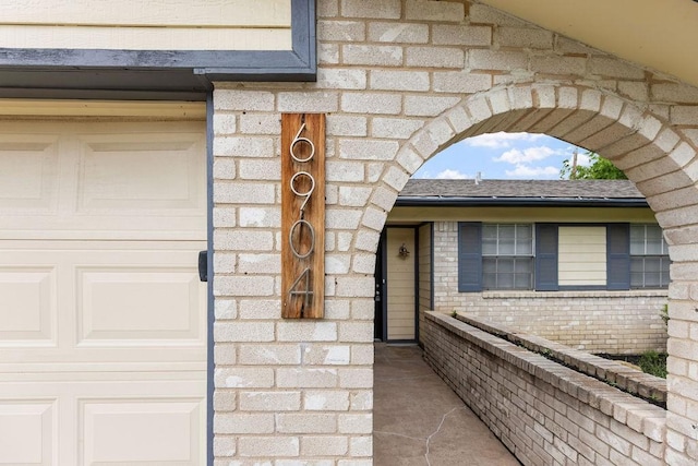 exterior space featuring brick siding