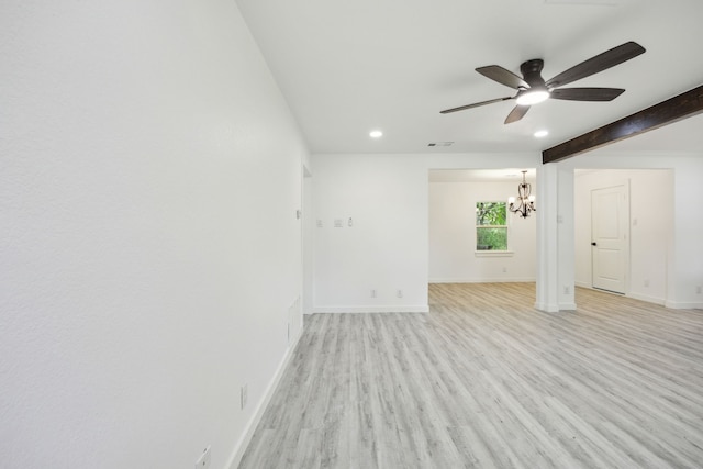 unfurnished living room with recessed lighting, baseboards, light wood-style flooring, and ceiling fan with notable chandelier