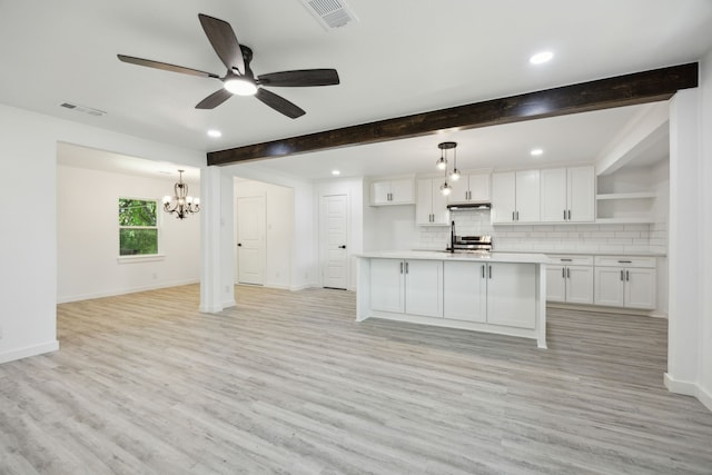 kitchen with visible vents, tasteful backsplash, open shelves, and white cabinetry