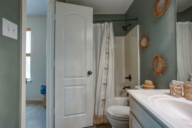 bathroom featuring shower / tub combo with curtain, toilet, vanity, and plenty of natural light