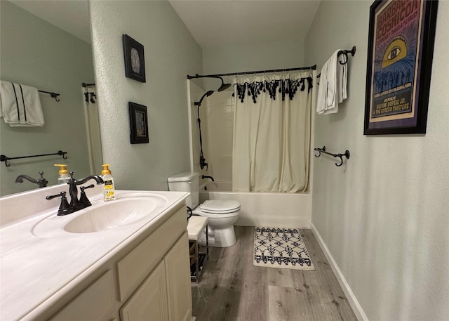 bathroom featuring shower / bath combo, wood finished floors, toilet, and vanity