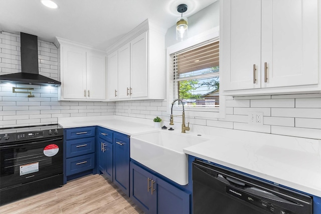kitchen featuring white cabinets, black electric range oven, oven, dishwashing machine, and wall chimney exhaust hood