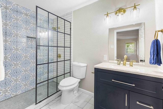 full bathroom with vanity, toilet, marble finish floor, and tiled shower