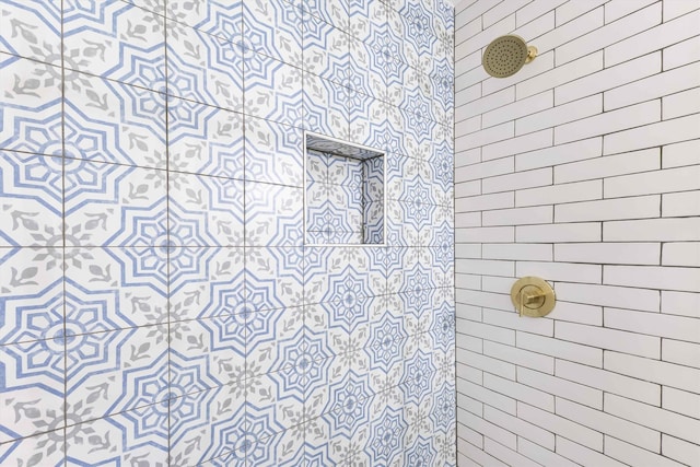 full bathroom with a tile shower
