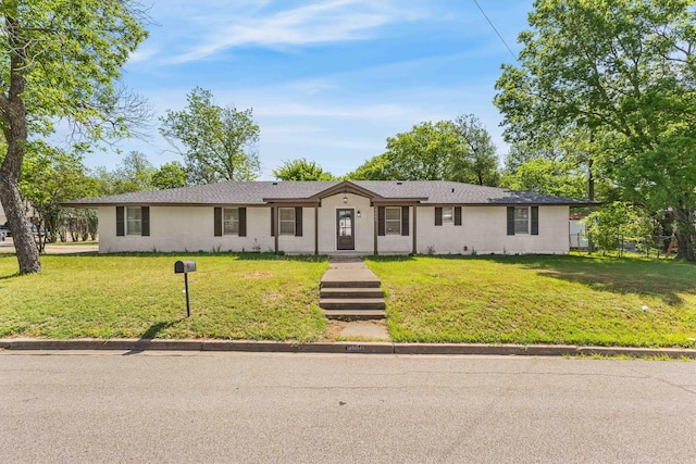 single story home featuring a front yard