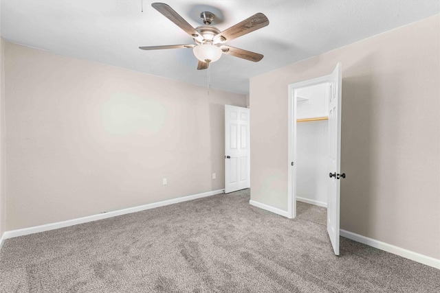 unfurnished bedroom with a ceiling fan, carpet flooring, a closet, and baseboards