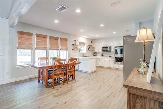 dining area with recessed lighting, visible vents, baseboards, and light wood-style floors