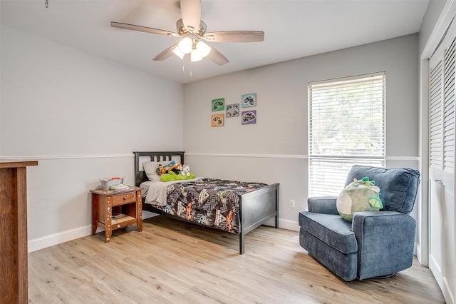 bedroom featuring wood finished floors, ceiling fan, and baseboards