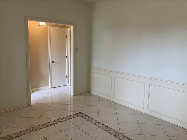 912 E Berkeley Dr, Richardson, TX 75081 - unfurnished room featuring light tile patterned floors and wainscoting
