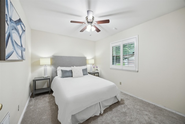 12312 Cox Ln, Dallas, TX 75244 - carpeted bedroom with baseboards and ceiling fan
