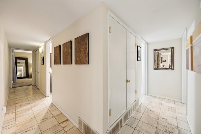 12312 Cox Ln, Dallas, TX 75244 - hall with light marble finish floors and baseboards