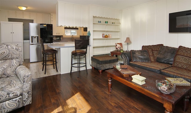living room featuring a toaster and hardwood / wood-style floors