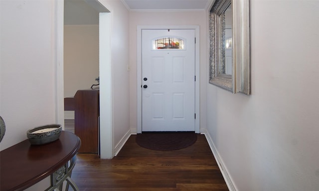 entryway featuring ornamental molding, wood finished floors, and baseboards