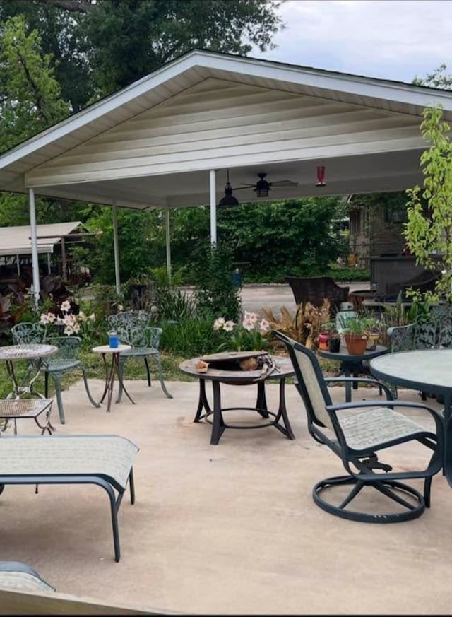 view of home's community featuring a gazebo, a patio area, and outdoor dining area