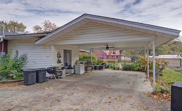 view of patio / terrace with driveway and ceiling fan