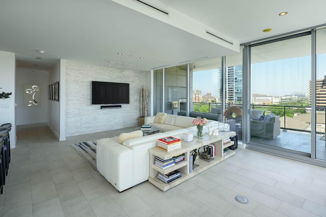 living room with light tile patterned flooring and expansive windows