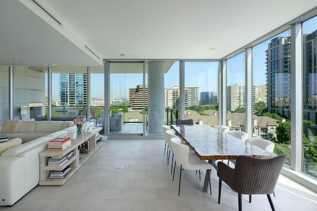 sunroom with plenty of natural light and a city view