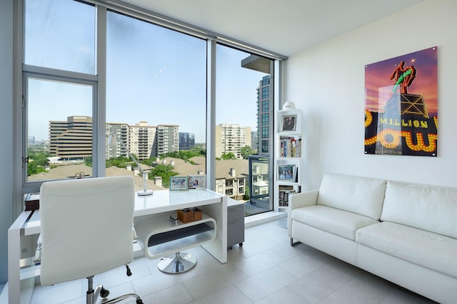 interior space with a wall of windows, a city view, and plenty of natural light