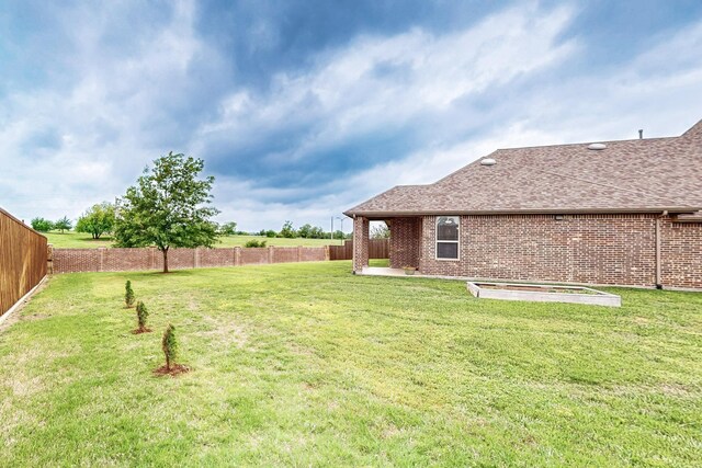 view of yard featuring a fenced backyard and a patio area