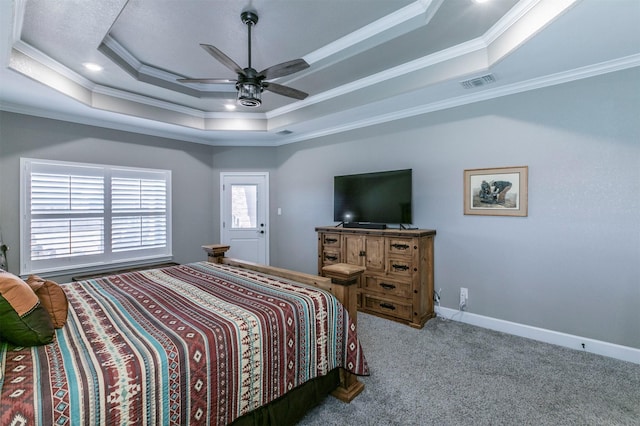 carpeted bedroom featuring a raised ceiling, visible vents, and ornamental molding