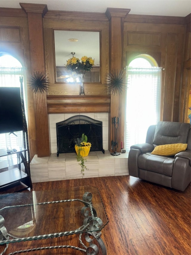 living room featuring wood finished floors and a tile fireplace
