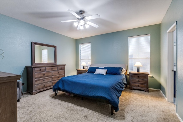 bedroom featuring baseboards, ceiling fan, and carpet floors
