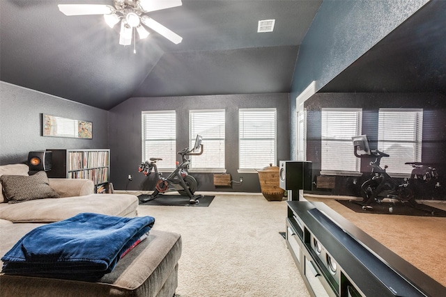 bedroom with lofted ceiling, visible vents, a textured wall, and carpet floors