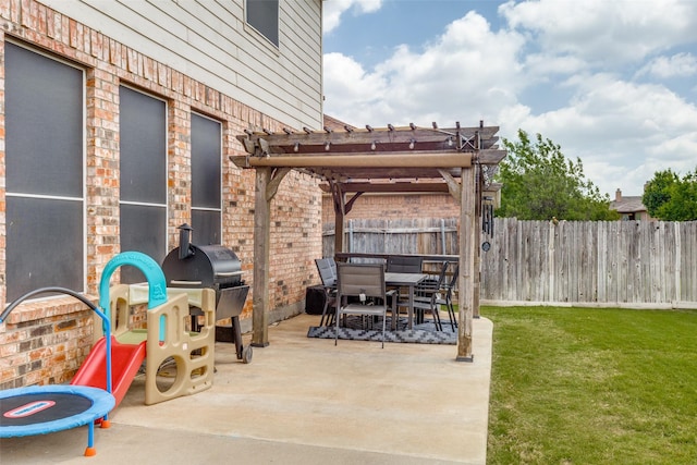 view of patio featuring outdoor dining area, a fenced backyard, and a pergola