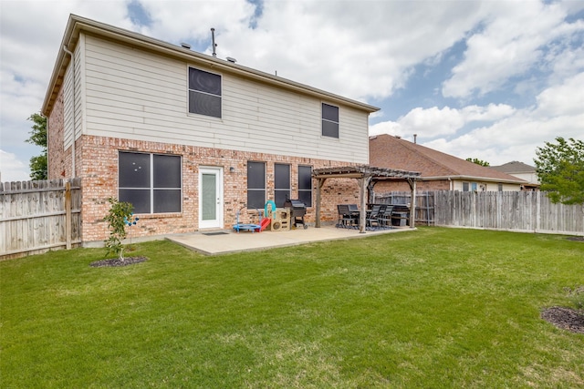 back of house with a pergola, a patio area, a fenced backyard, and brick siding