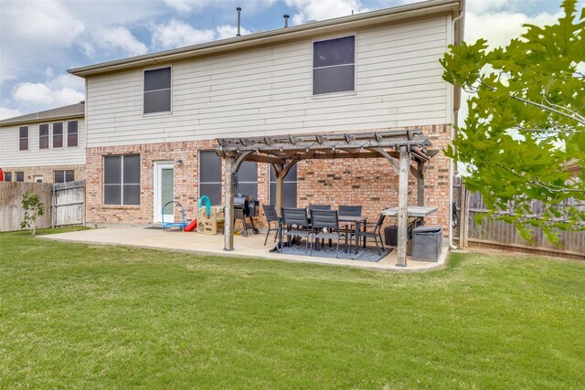 back of property featuring a pergola, a yard, a fenced backyard, and brick siding