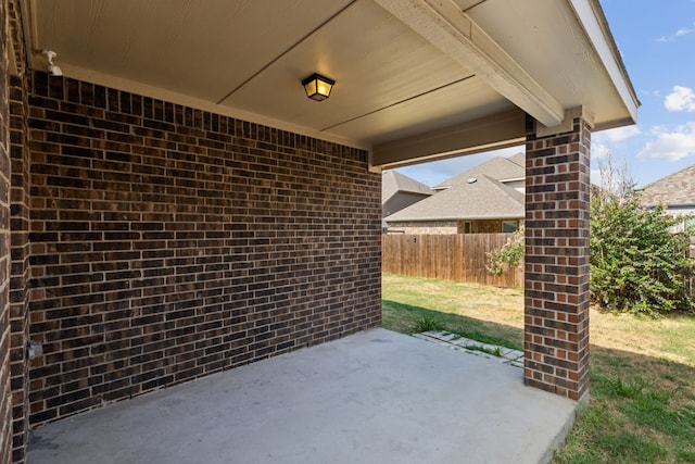 view of patio featuring fence