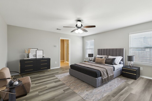 2050 Enchanted Rock Dr, Forney, TX 75126 - bedroom featuring multiple windows, wood finished floors, and baseboards