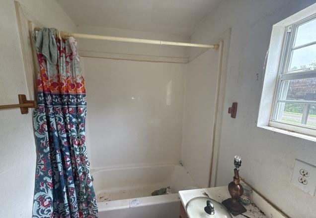 full bathroom featuring shower / tub combo and vanity