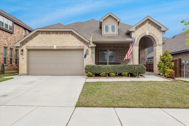 view of front facade featuring concrete driveway, stone siding, roof with shingles, an attached garage, and brick siding