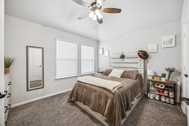 bedroom with dark carpet, a ceiling fan, vaulted ceiling, and baseboards