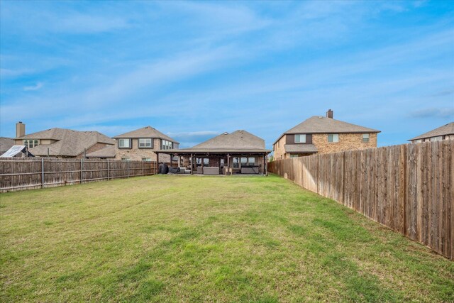 view of yard featuring a gazebo and a fenced backyard