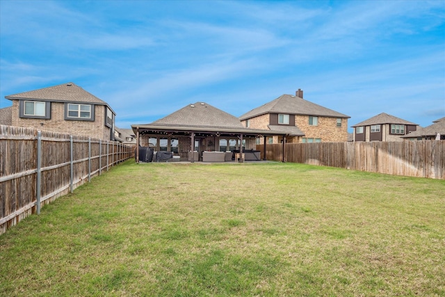 view of yard featuring a gazebo and a fenced backyard