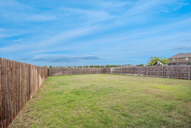 view of yard with a fenced backyard