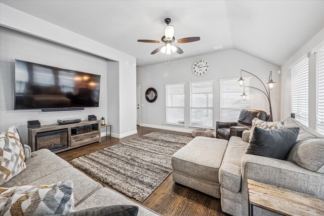 living room featuring wood finished floors, ceiling fan, baseboards, visible vents, and lofted ceiling