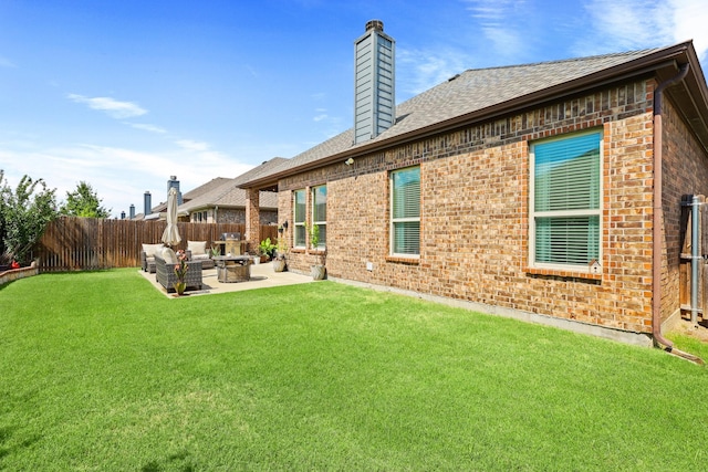 3900 Fordham St, Frisco, TX 75036 - back of house with a chimney, brick siding, fence, and a yard