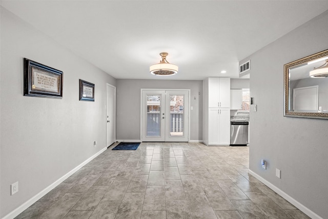 entryway featuring visible vents, baseboards, french doors, and plenty of natural light