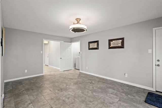 empty room featuring baseboards
