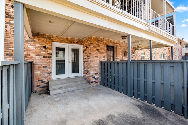 view of patio featuring french doors and a balcony