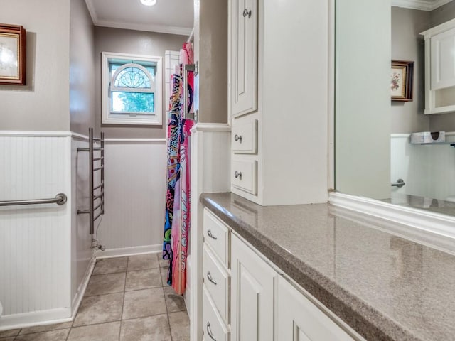 1413 Sylvan Dr, Arlington, TX 76012 - bathroom with crown molding, vanity, tile patterned floors, a wainscoted wall, and a shower with curtain
