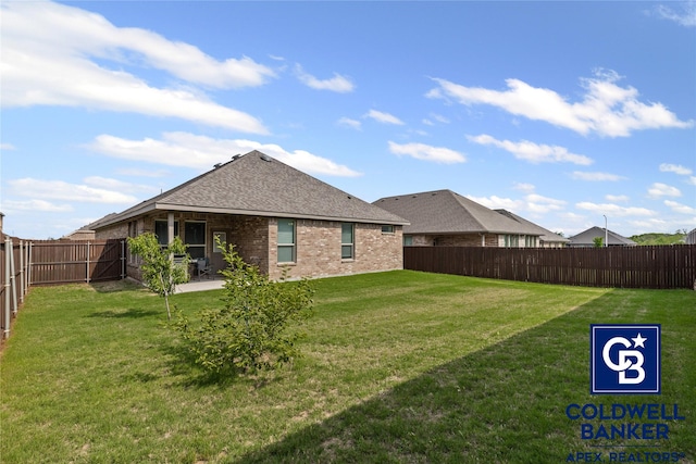 view of yard with a patio and a fenced backyard