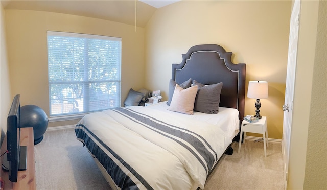 bedroom featuring baseboards, carpet flooring, and lofted ceiling