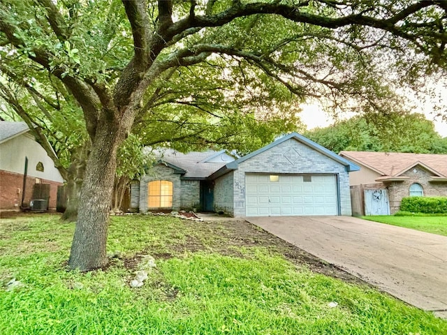 1809 Ramada Dr, Waco, TX 76712 - single story home with concrete driveway, a garage, and a front yard