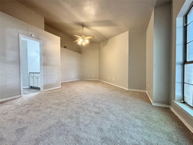 1809 Ramada Dr, Waco, TX 76712 - empty room featuring carpet floors, ceiling fan, and lofted ceiling
