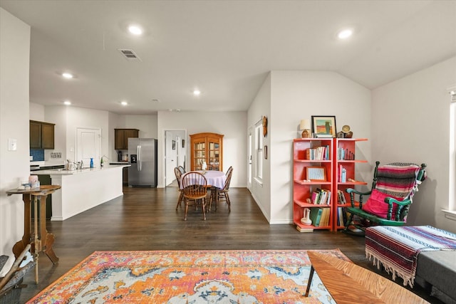 1417 Briar Hl, Denton, TX 76207 - dining space featuring recessed lighting, dark wood finished floors, baseboards, and lofted ceiling