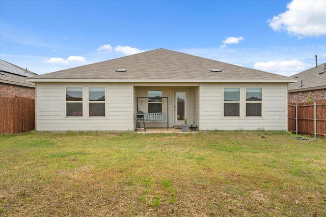 1417 Briar Hl, Denton, TX 76207 - back of house with a patio area and a shingled roof